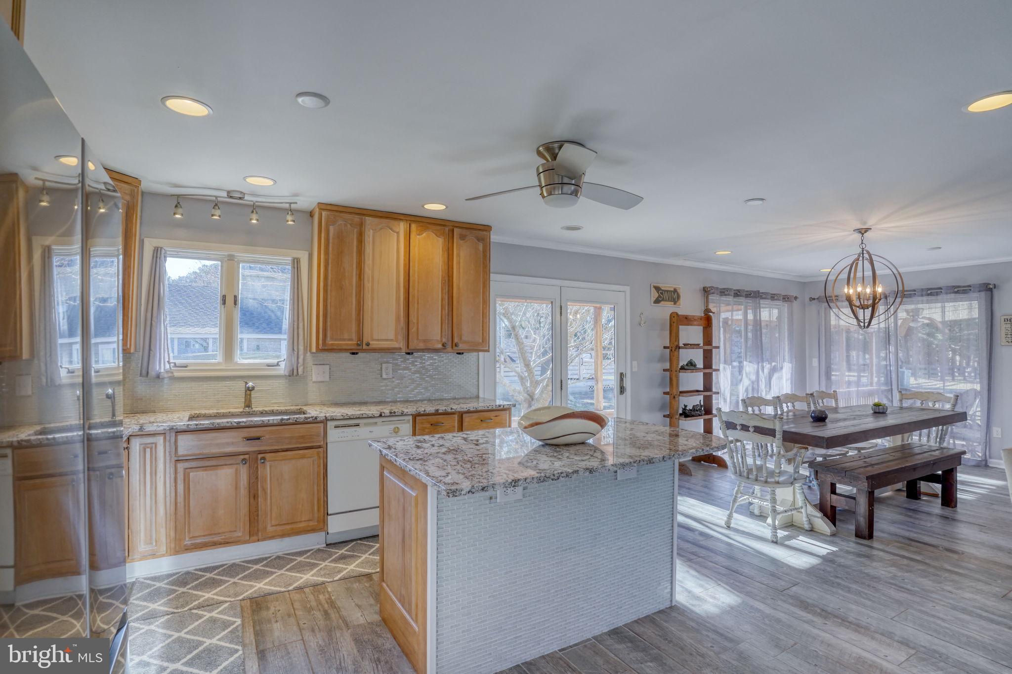 34772 Frontier Road Lewes, DE 19958 - Photo 12 of 66 a living room with stainless steel appliances granite countertop furniture and a wooden floor