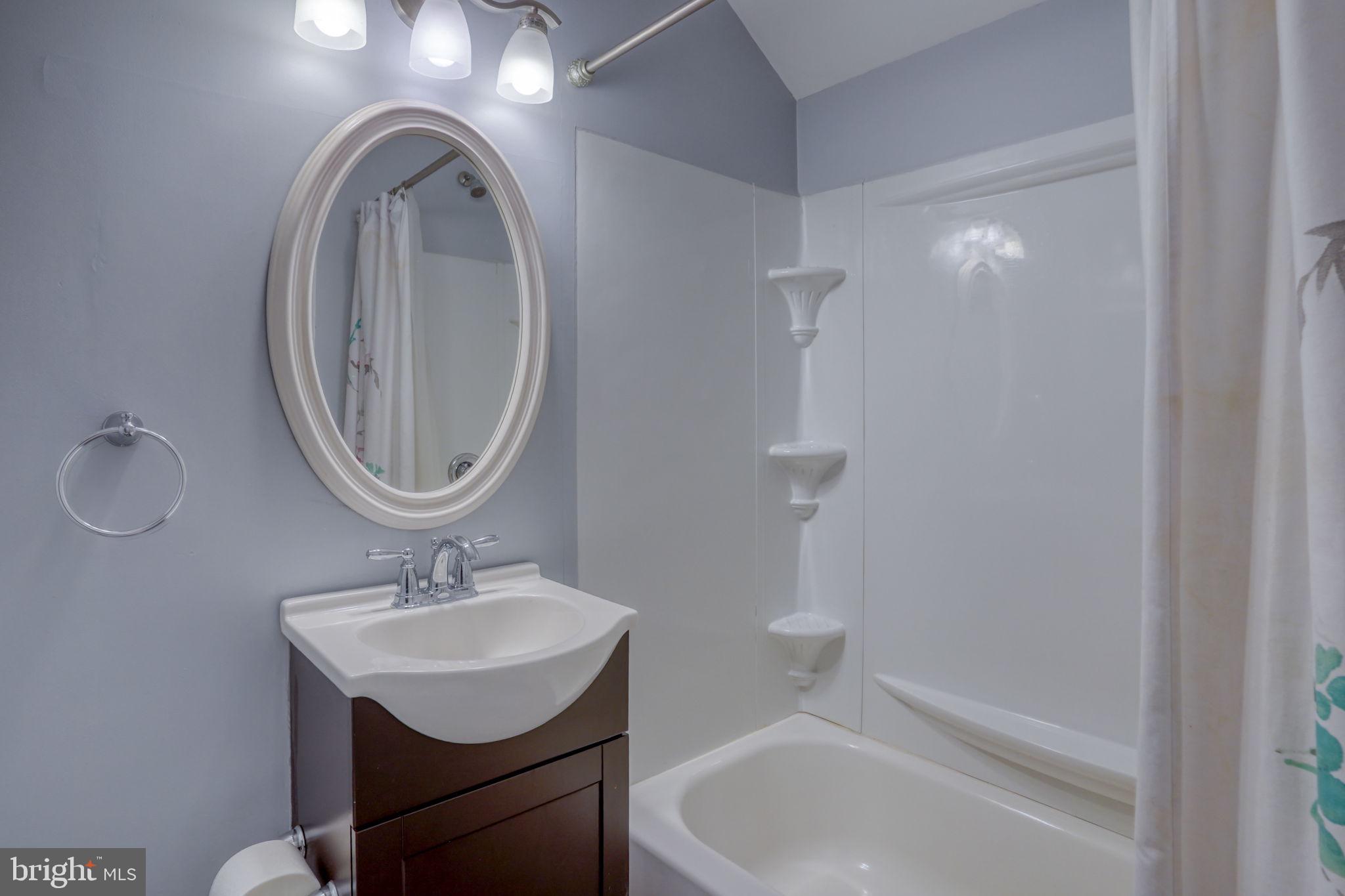 34772 Frontier Road Lewes, DE 19958 - Photo 24 of 66 a bathroom with a sink a toilet and a mirror