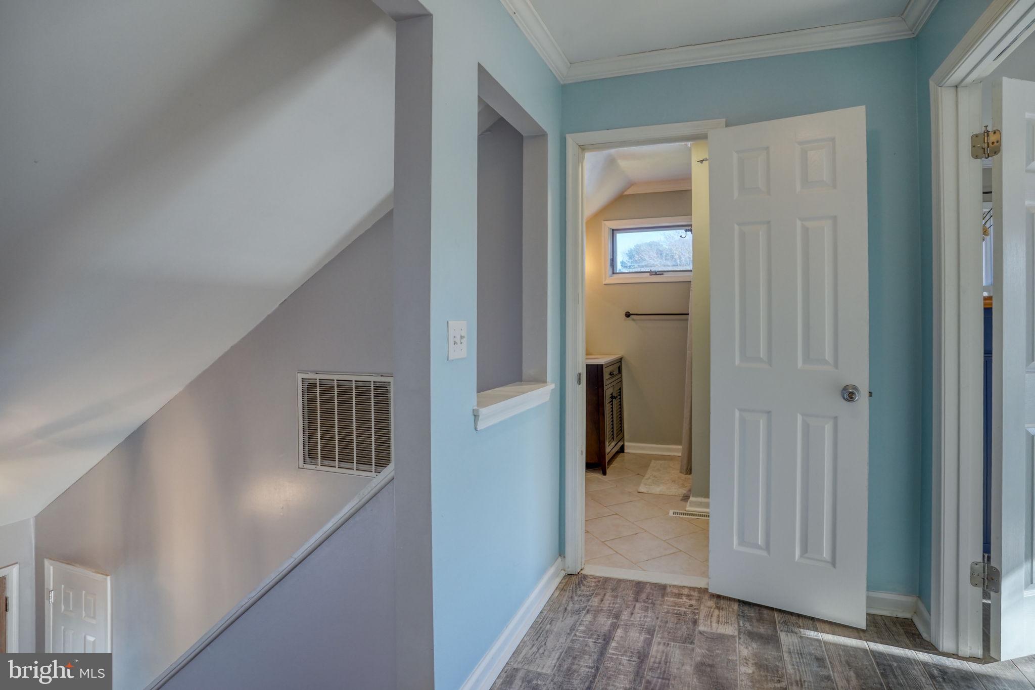 34772 Frontier Road Lewes, DE 19958 - Photo 34 of 66 a view of a hallway with wooden floor and entryway