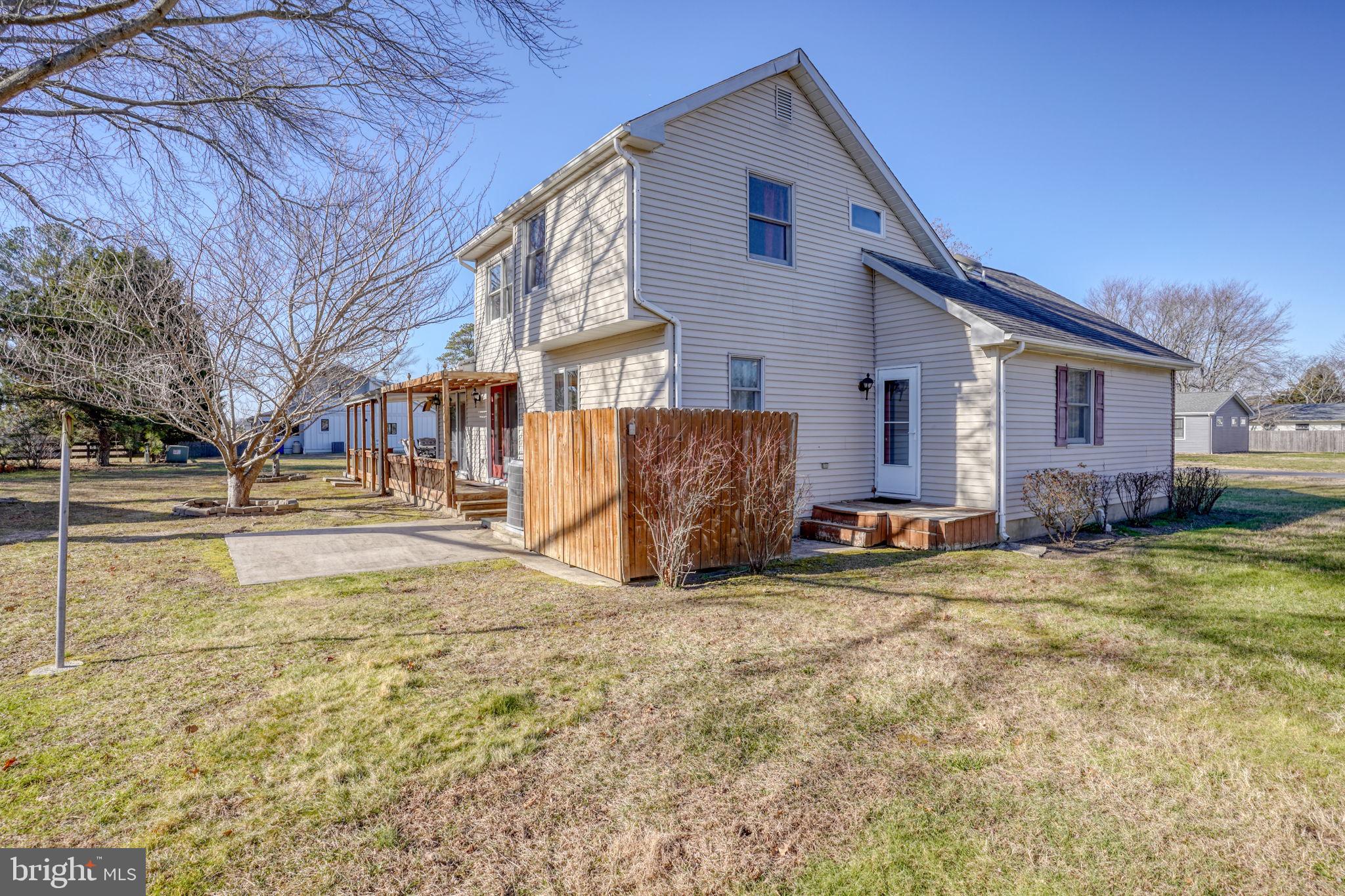 34772 Frontier Road Lewes, DE 19958 - Photo 36 of 66 a view of a house with snow on the wall