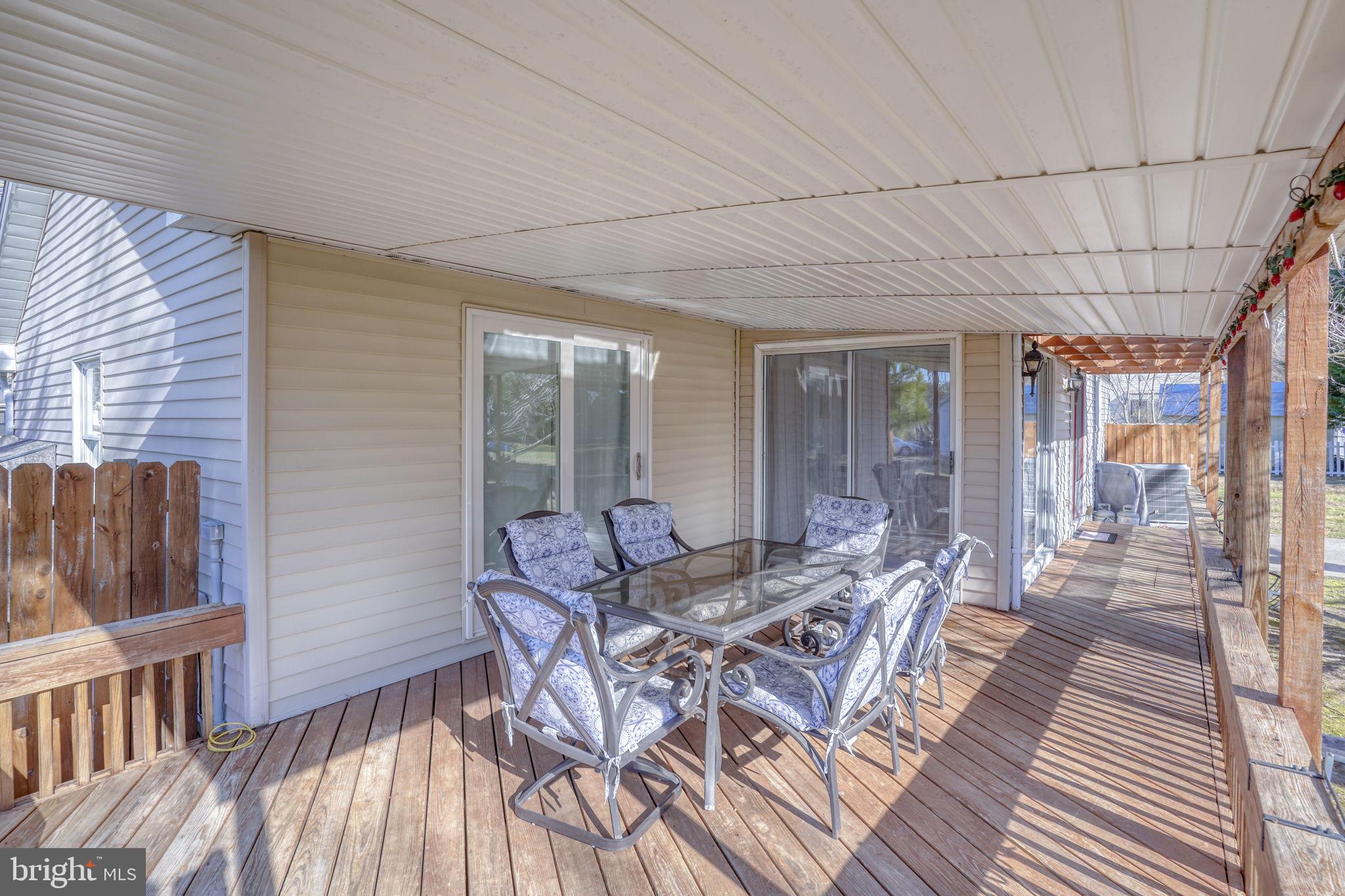 34772 Frontier Road Lewes, DE 19958 - Photo 40 of 66 a dining room with furniture and wooden floor