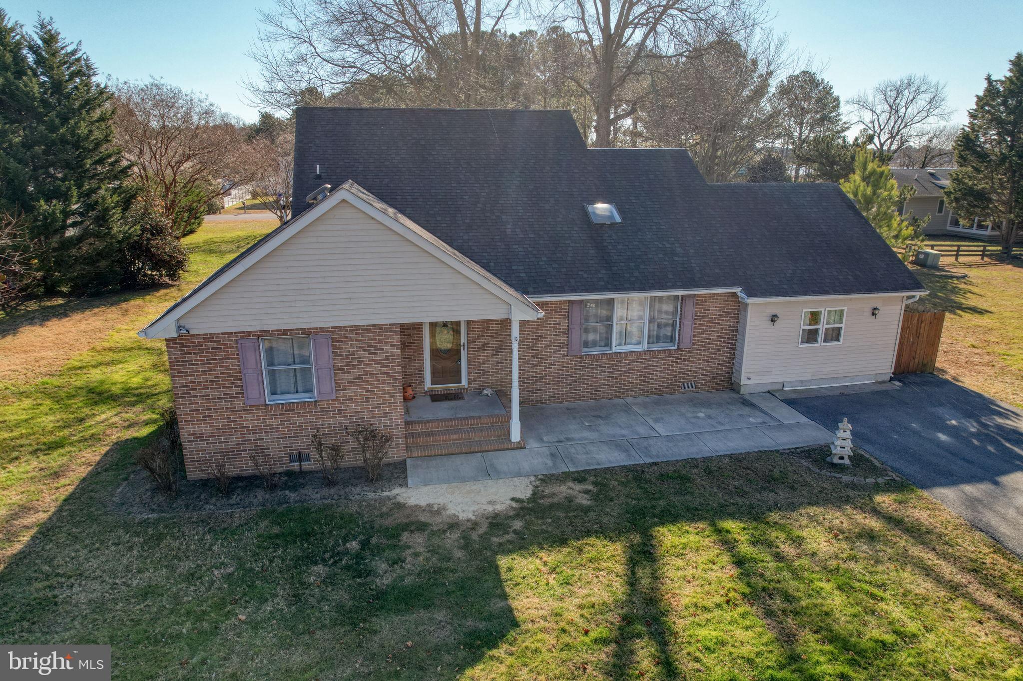 34772 Frontier Road Lewes, DE 19958 - Photo 4 of 66 a aerial view of a house next to a yard with large tree