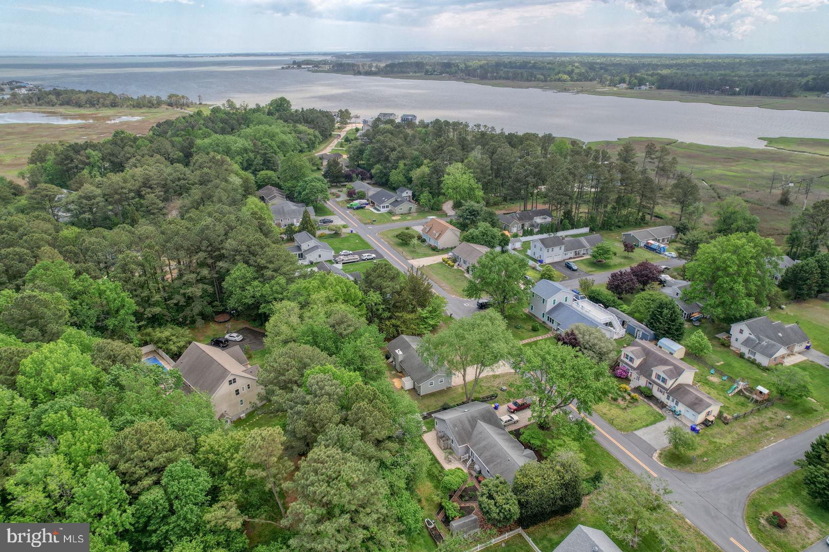 34772 Frontier Road Lewes, DE 19958 - Photo 46 of 66 an aerial view of residential houses with outdoor space and trees