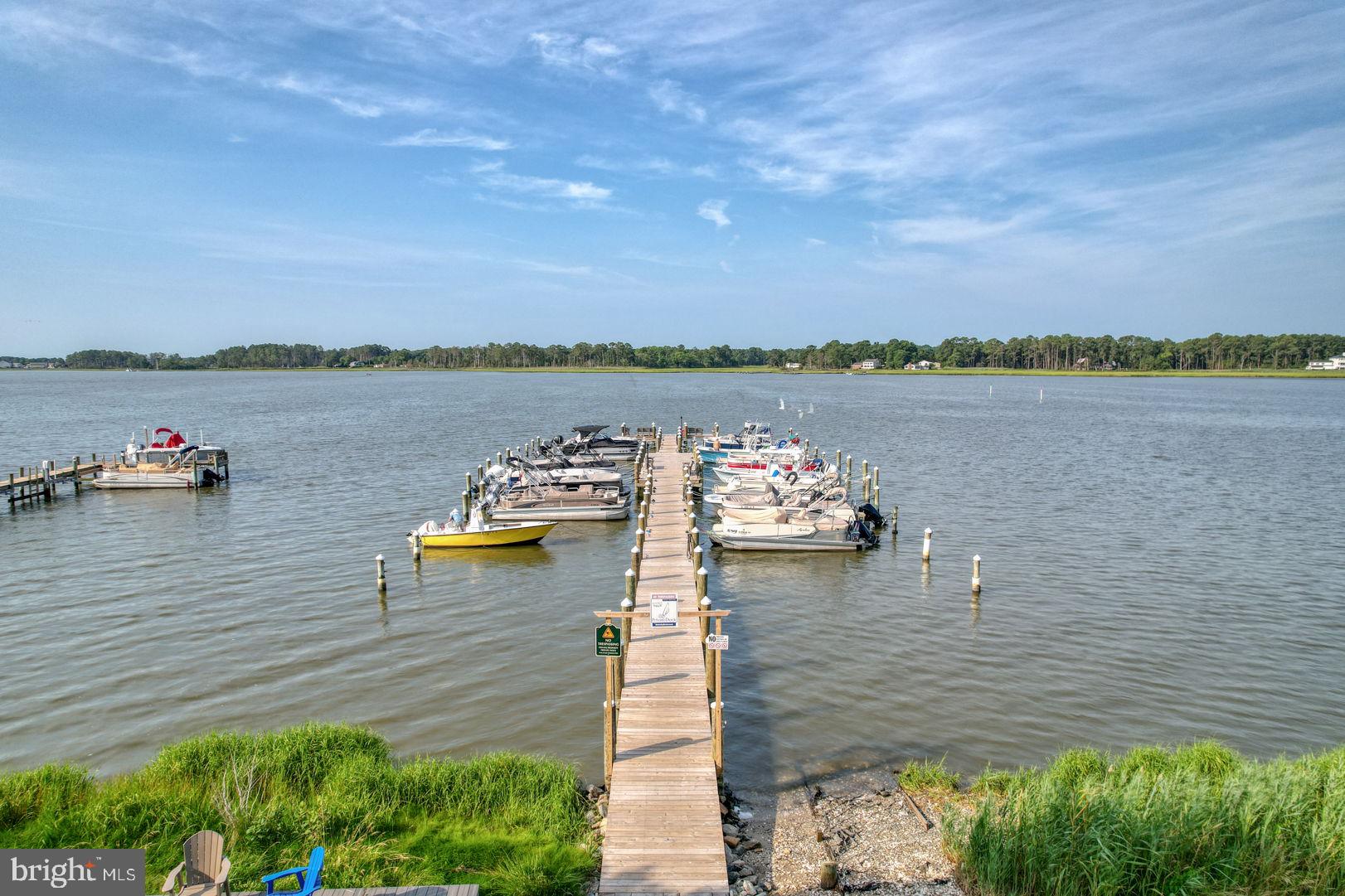34772 Frontier Road Lewes, DE 19958 - Photo 60 of 66 a view of a lake with a terrace