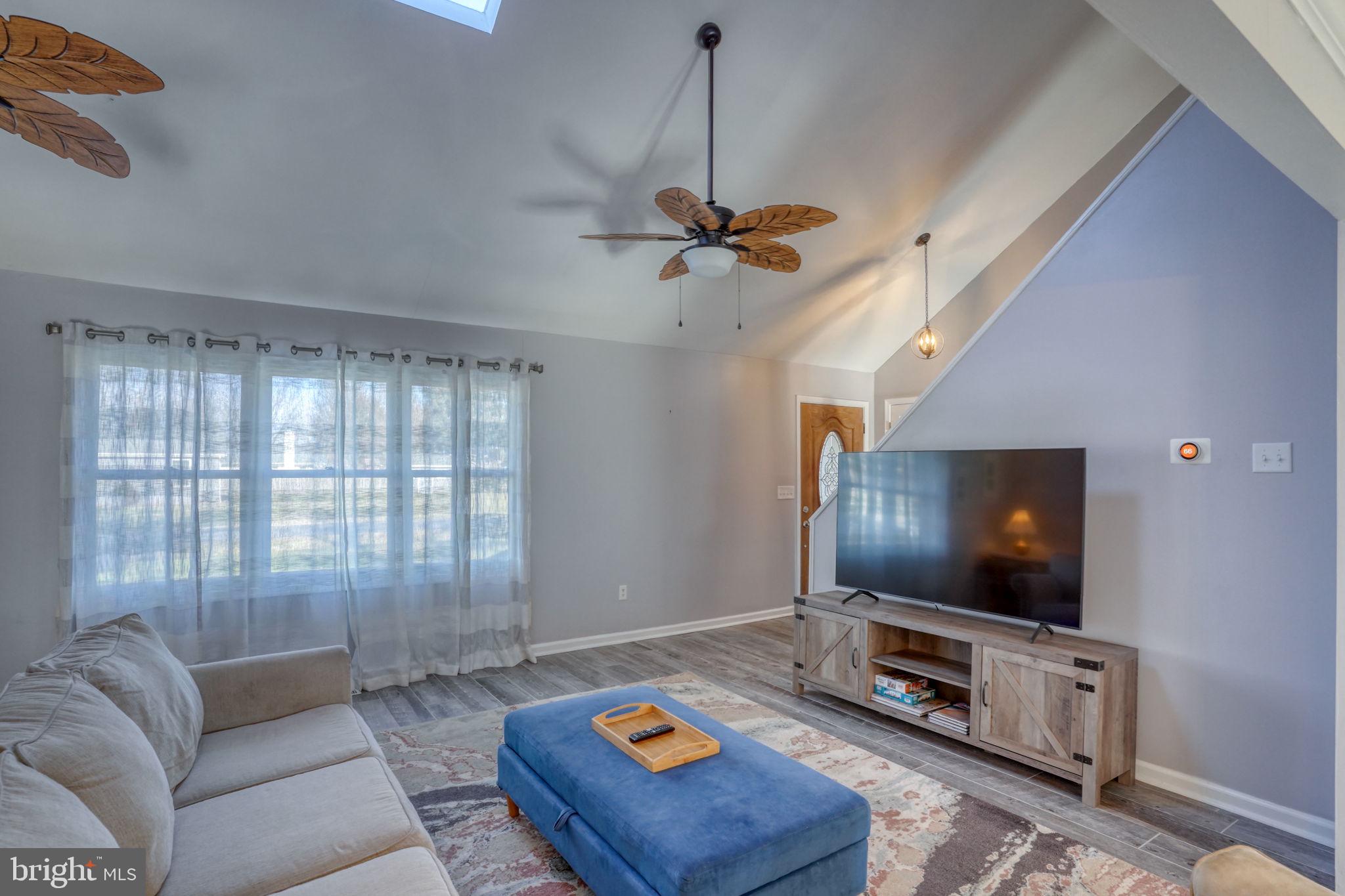 34772 Frontier Road Lewes, DE 19958 - Photo 6 of 66 a living room with furniture and a flat screen tv