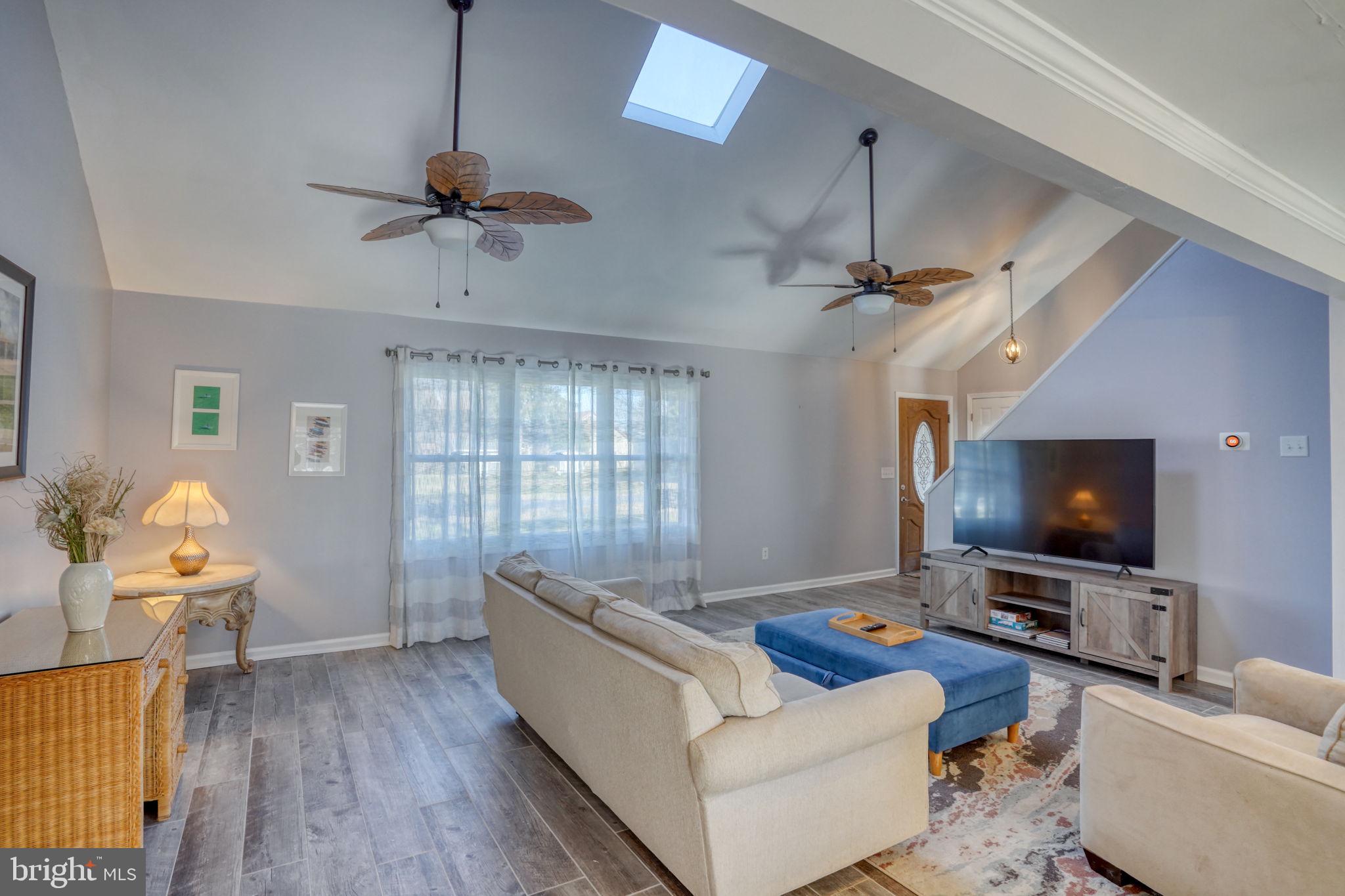 34772 Frontier Road Lewes, DE 19958 - Photo 7 of 66 a living room with furniture and a flat screen tv
