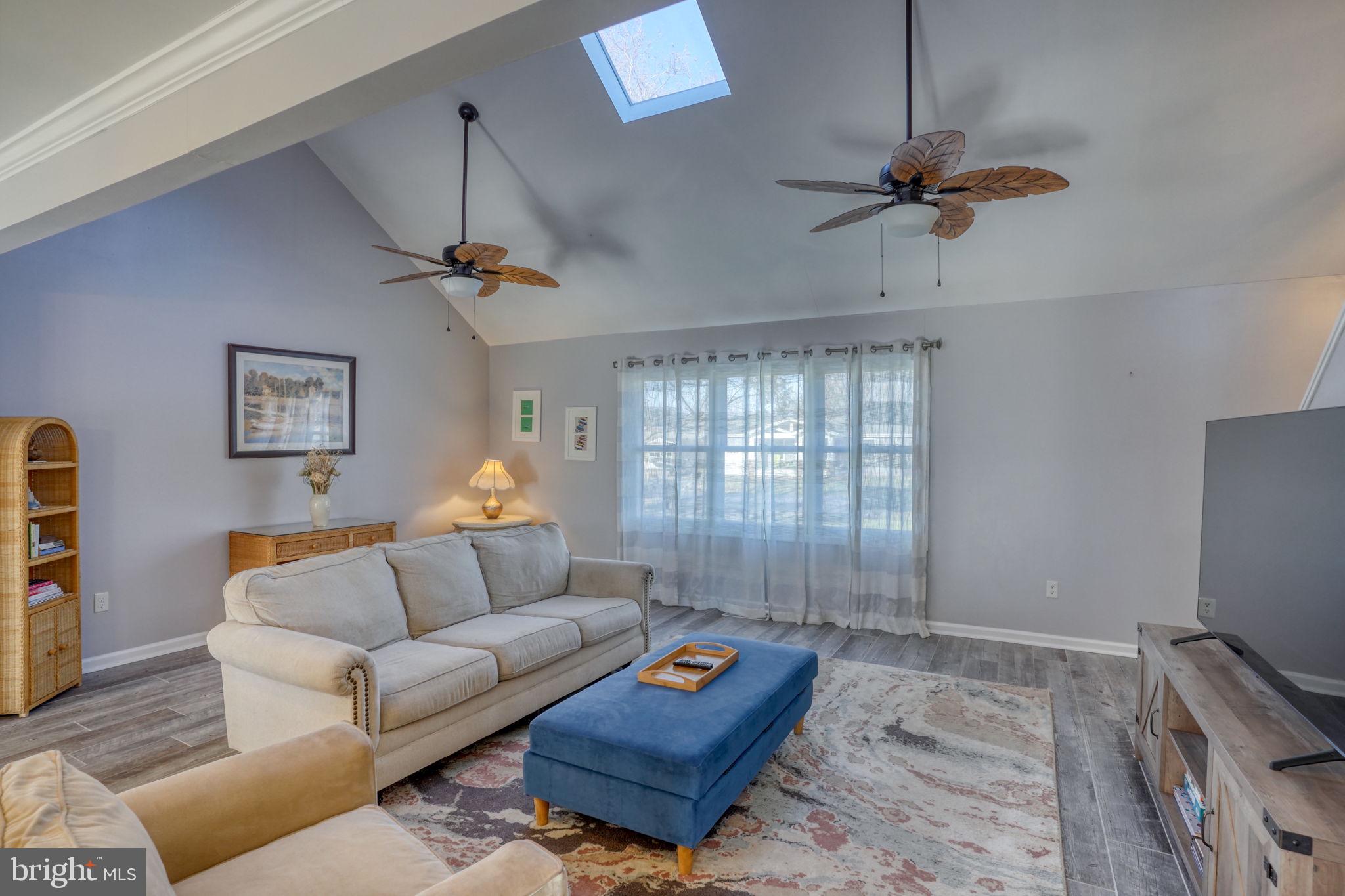 34772 Frontier Road Lewes, DE 19958 - Photo 9 of 66 a living room with furniture and a flat screen tv