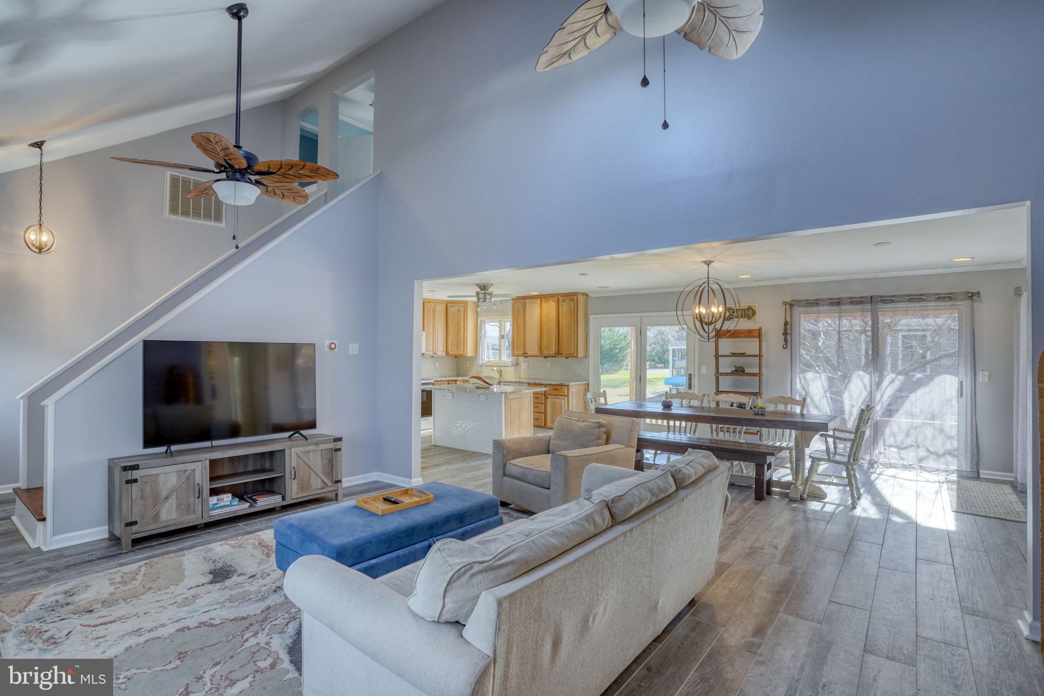 34772 Frontier Road Lewes, DE 19958 - Photo 10 of 66 a living room with furniture and a flat screen tv