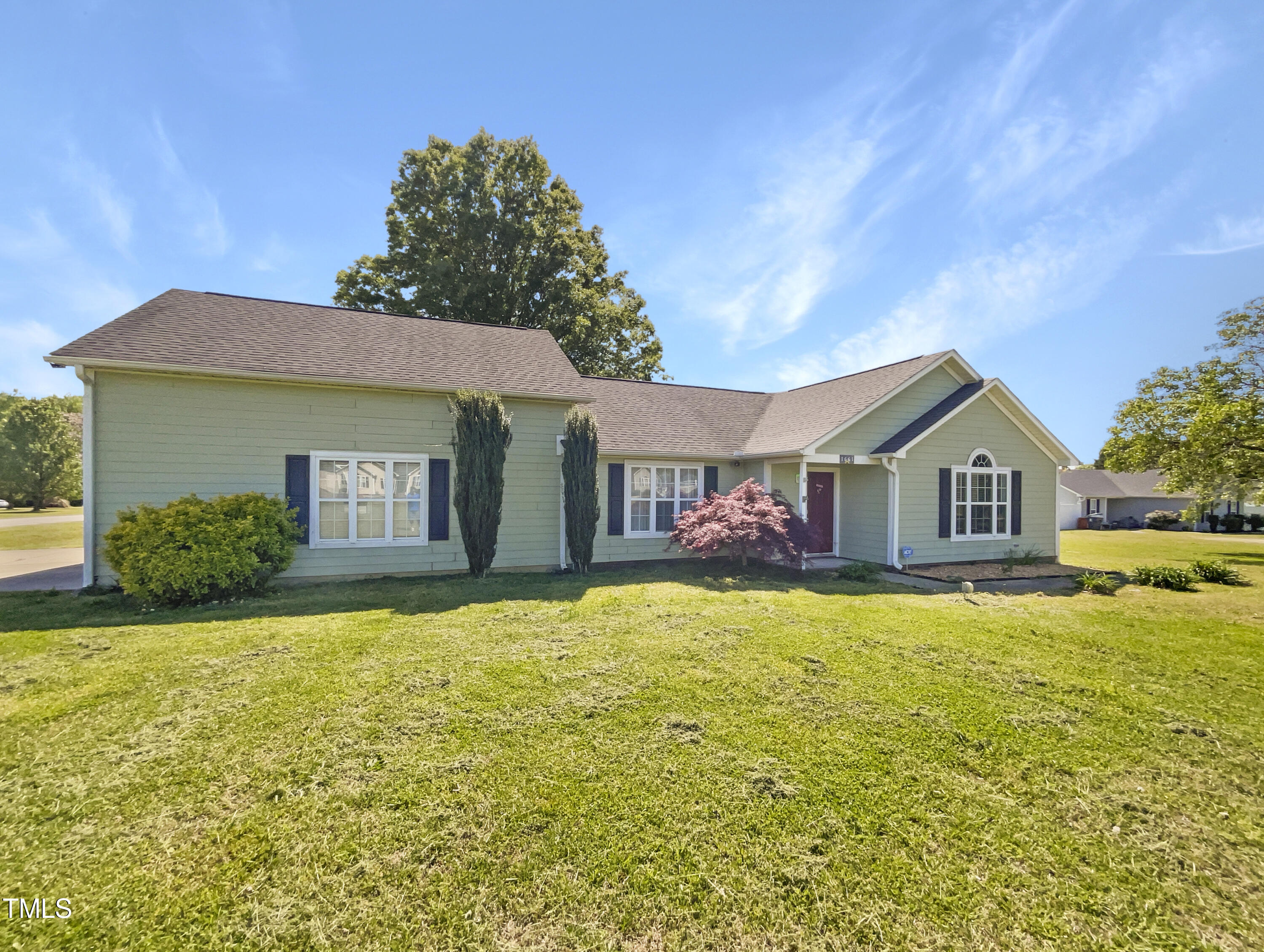 a house view with a garden space