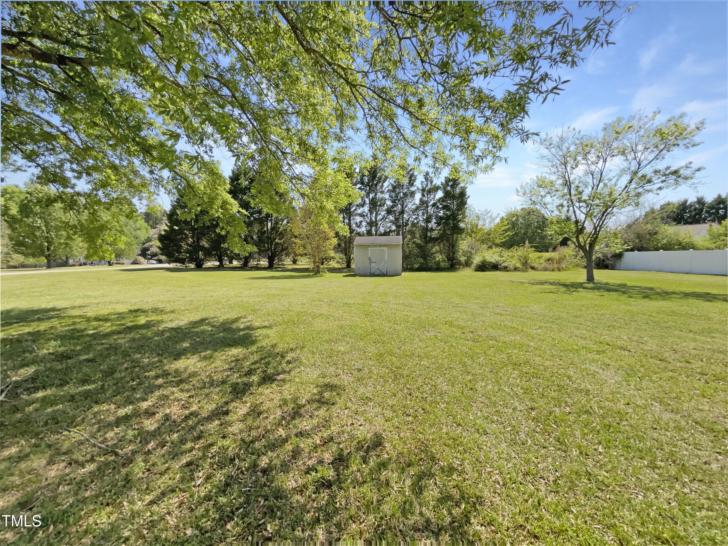 1661 Lee Road Clayton, NC 27520 - Photo 14 of 15 a view of a big yard with large trees