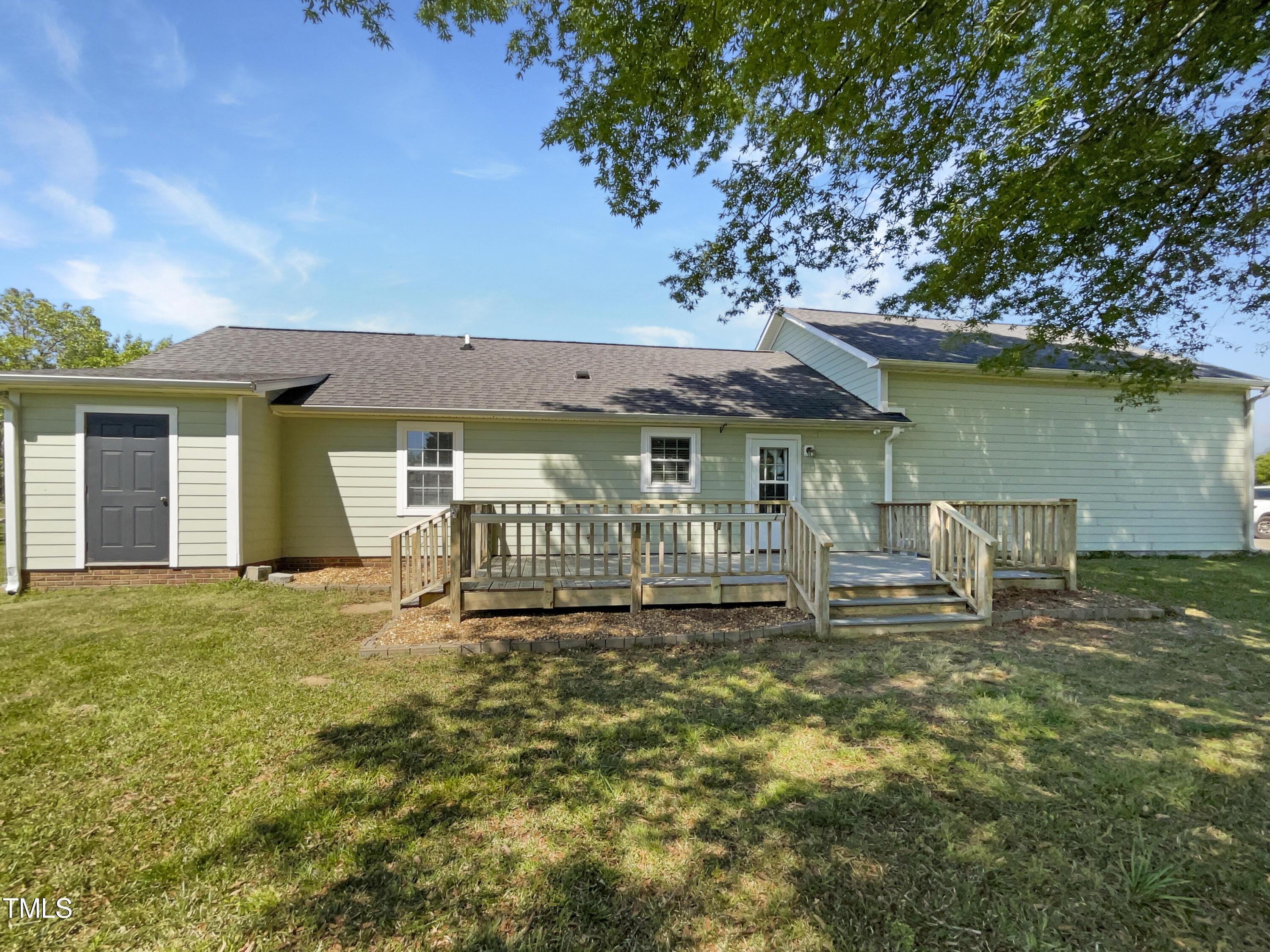 1661 Lee Road Clayton, NC 27520 - Photo 15 of 15 a view of a house with a yard and sitting area