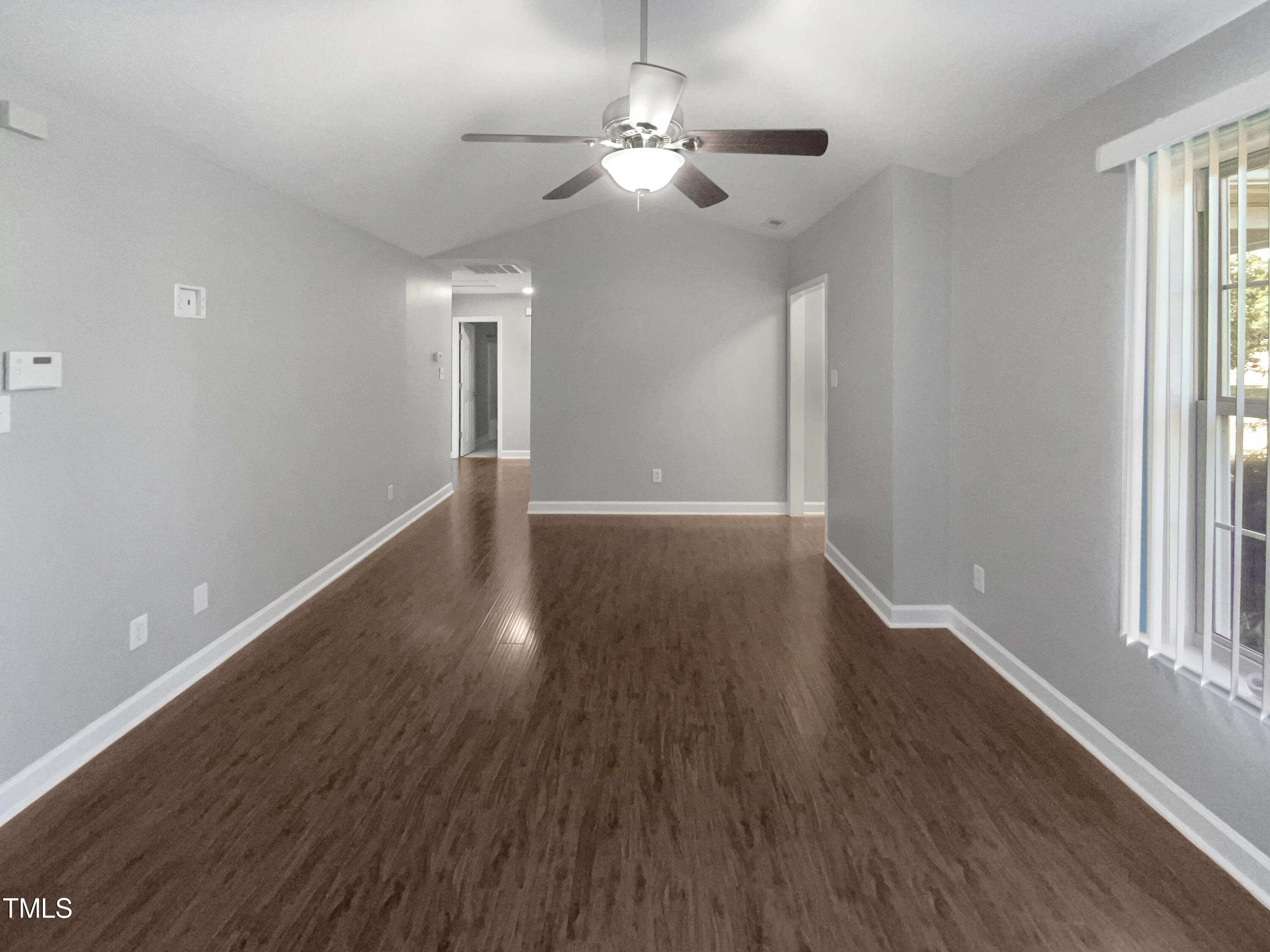 1661 Lee Road Clayton, NC 27520 - Photo 3 of 15 wooden floor in an empty room with a window