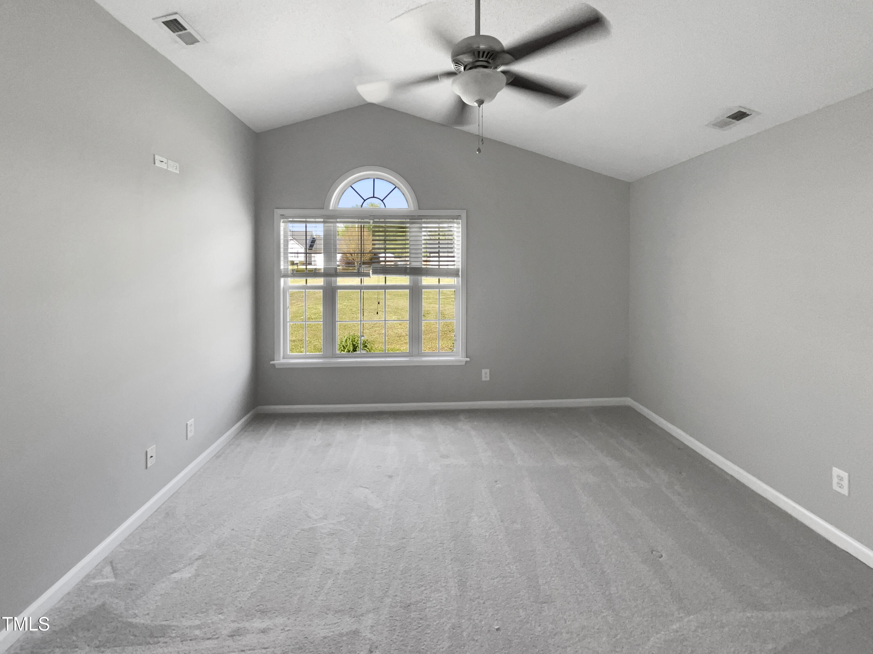 1661 Lee Road Clayton, NC 27520 - Photo 6 of 15 an empty room with a window