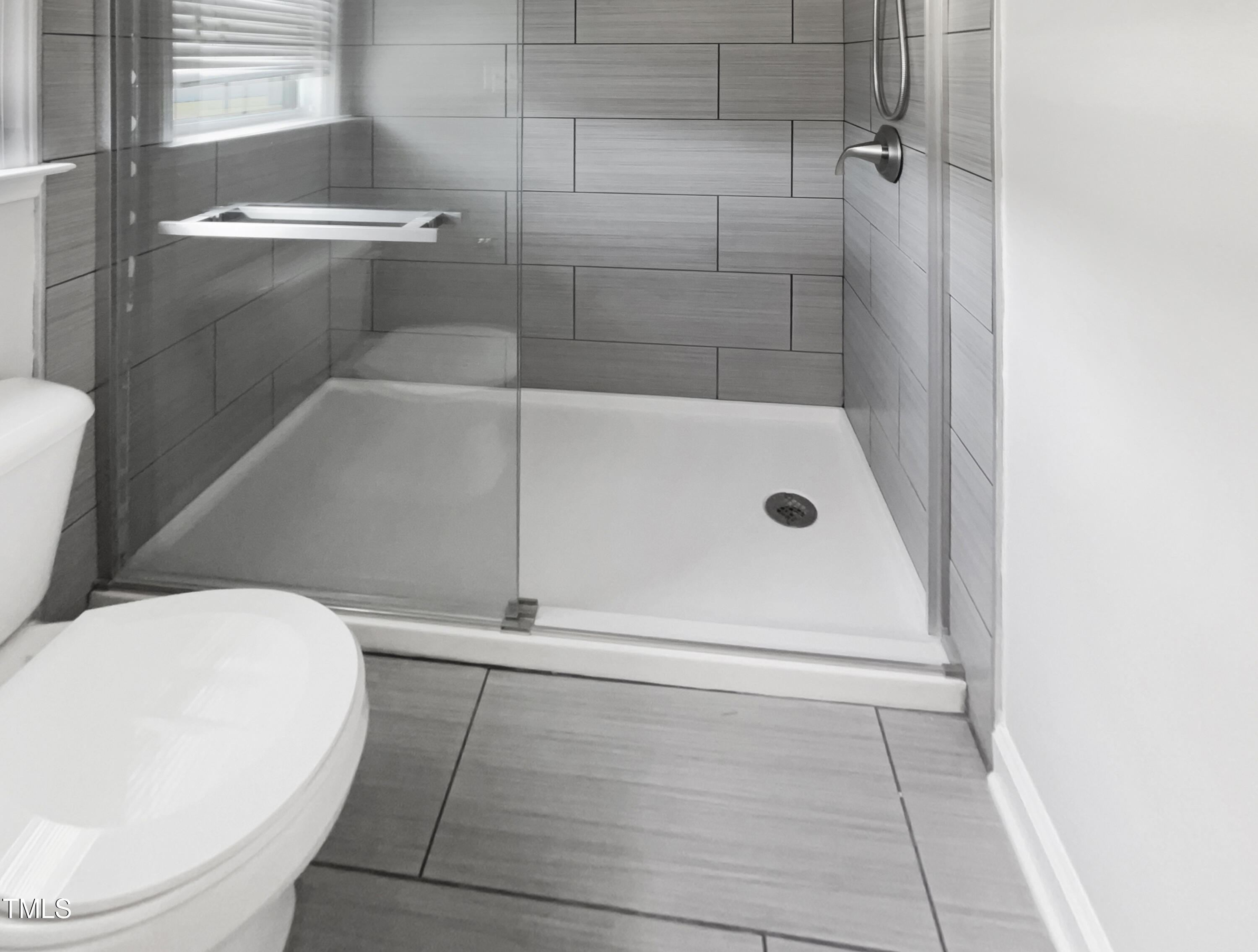 1661 Lee Road Clayton, NC 27520 - Photo 8 of 15 a bathroom with a bathtub