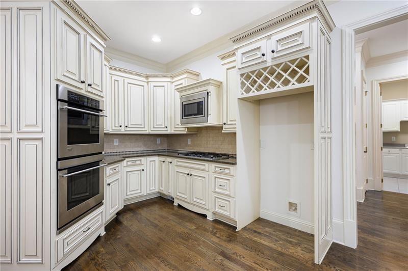 6186 Talmadge Run Acworth, GA 30101 - Photo 13 of 54 a kitchen with stainless steel appliances granite countertop a stove and a refrigerator