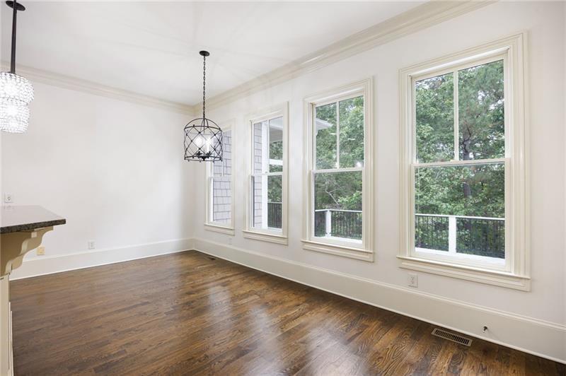 6186 Talmadge Run Acworth, GA 30101 - Photo 15 of 54 a view of an empty room with wooden floor and a window