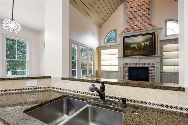 6186 Talmadge Run Acworth, GA 30101 - Photo 17 of 54 a kitchen with a sink and a stove top oven