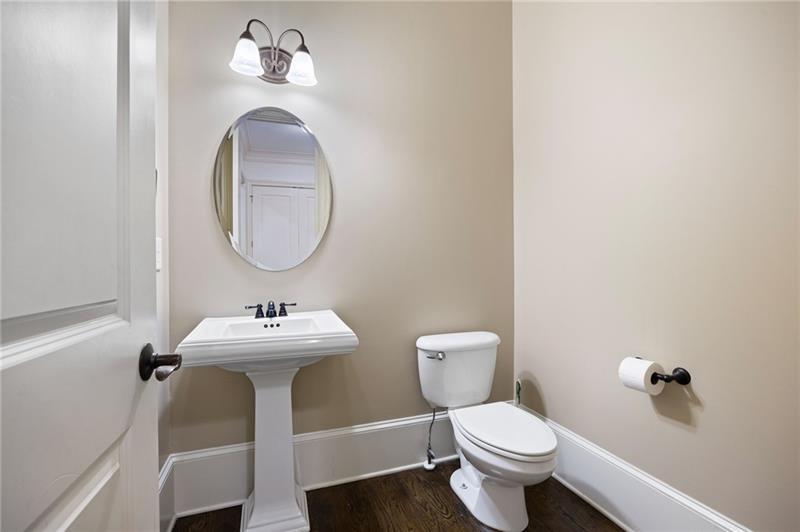 6186 Talmadge Run Acworth, GA 30101 - Photo 20 of 54 a bathroom with a toilet sink and mirror