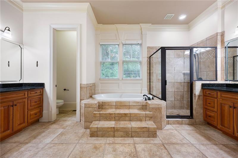 6186 Talmadge Run Acworth, GA 30101 - Photo 23 of 54 a bathroom with a tub sink and mirror