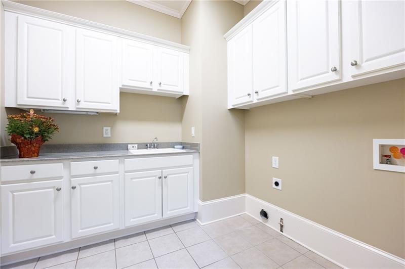 6186 Talmadge Run Acworth, GA 30101 - Photo 25 of 54 a kitchen with granite countertop white cabinets and a stove