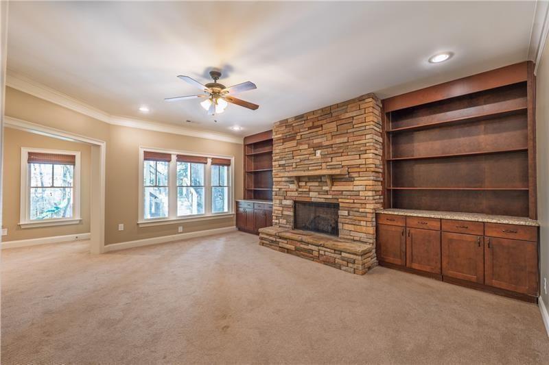 6186 Talmadge Run Acworth, GA 30101 - Photo 27 of 54 a view of an empty room with a fireplace and a window