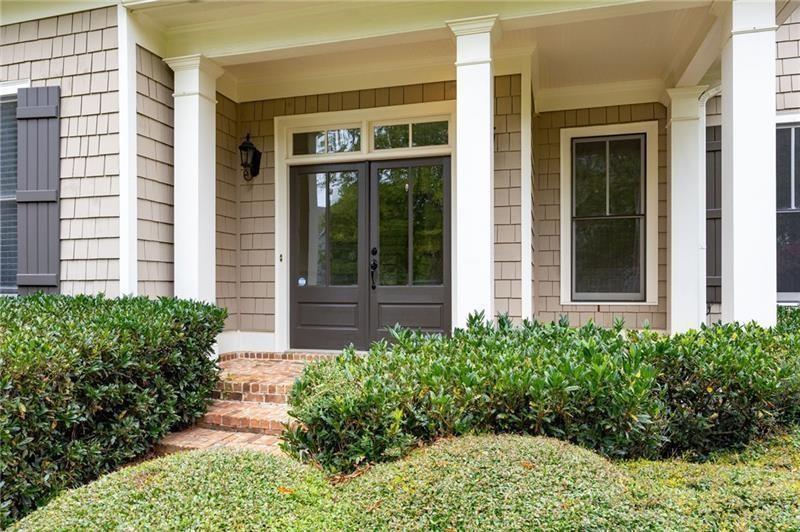 6186 Talmadge Run Acworth, GA 30101 - Photo 3 of 54 front view of a brick house with a large windows