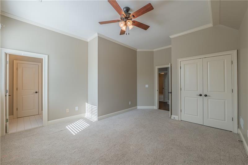 6186 Talmadge Run Acworth, GA 30101 - Photo 35 of 54 a view of an empty room and a ceiling fan