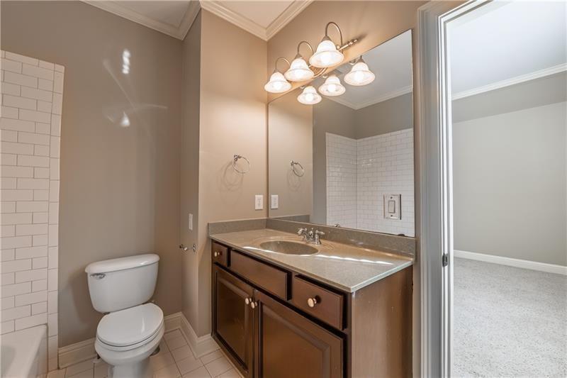6186 Talmadge Run Acworth, GA 30101 - Photo 36 of 54 a bathroom with a toilet sink and mirror