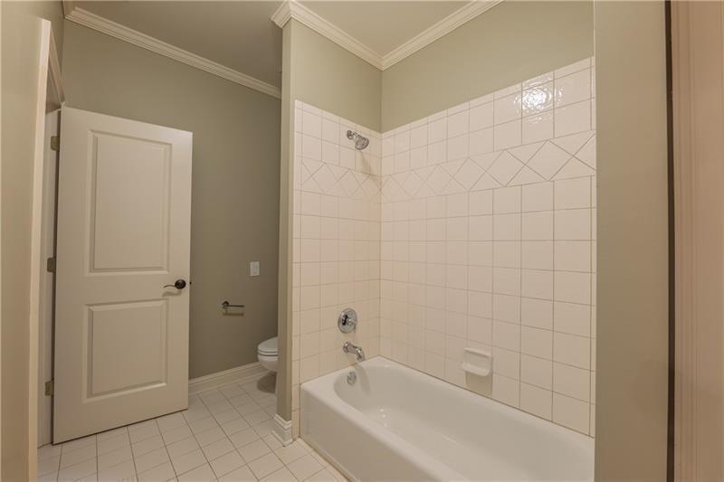 6186 Talmadge Run Acworth, GA 30101 - Photo 41 of 54 a bathroom with a bathtub and toilet