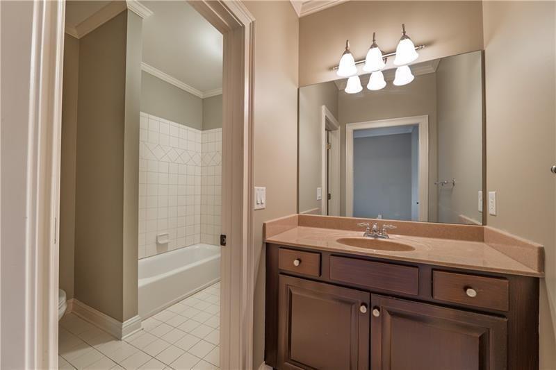 6186 Talmadge Run Acworth, GA 30101 - Photo 42 of 54 a bathroom with a tub sink and mirror