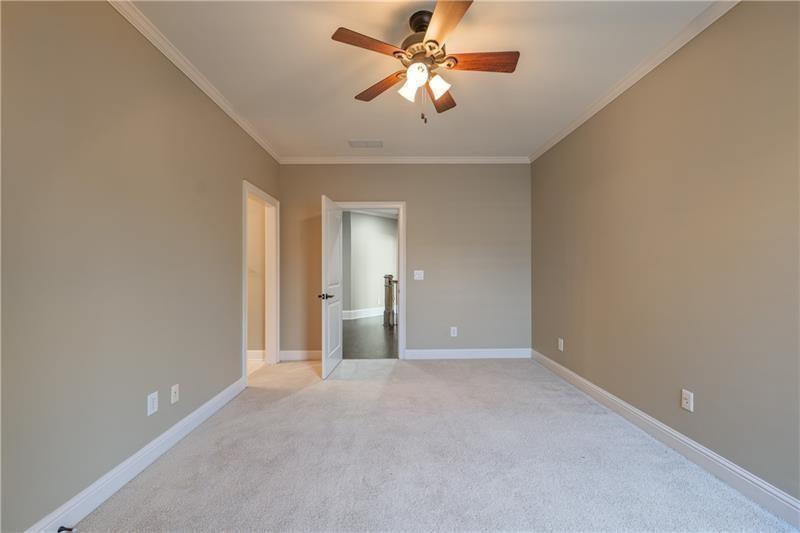 6186 Talmadge Run Acworth, GA 30101 - Photo 43 of 54 a view of a big room with a chandelier fan and windows
