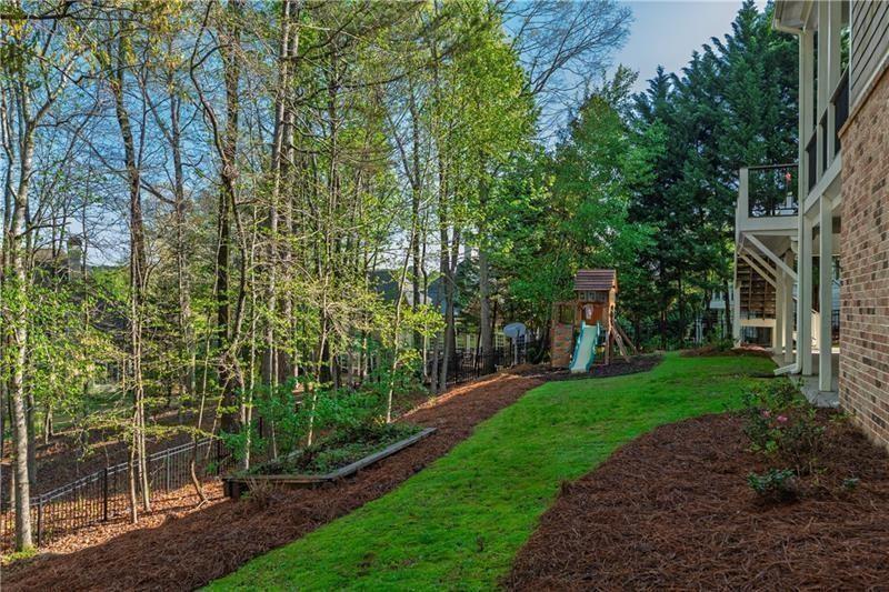6186 Talmadge Run Acworth, GA 30101 - Photo 48 of 54 a view of a backyard with garden