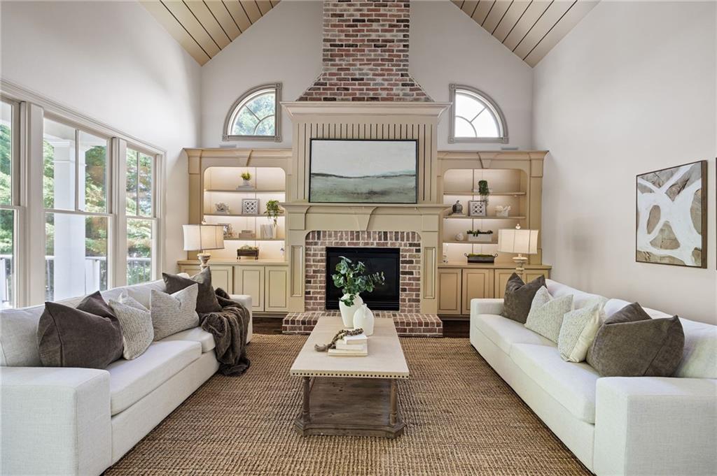 6186 Talmadge Run Acworth, GA 30101 - Photo 5 of 54 a living room with furniture a large window and a fireplace