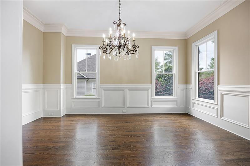 6186 Talmadge Run Acworth, GA 30101 - Photo 8 of 54 a view of an empty room with wooden floor and a window