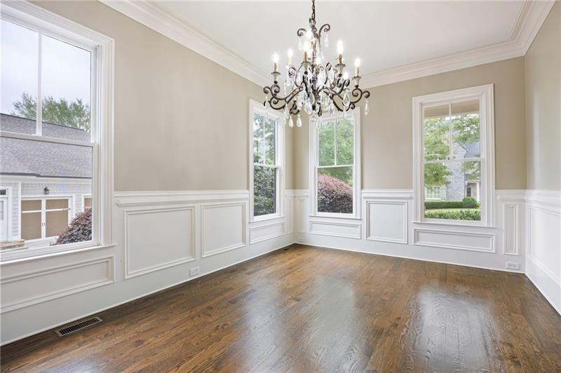 6186 Talmadge Run Acworth, GA 30101 - Photo 9 of 54 a view of a room with wooden floors and chandelier
