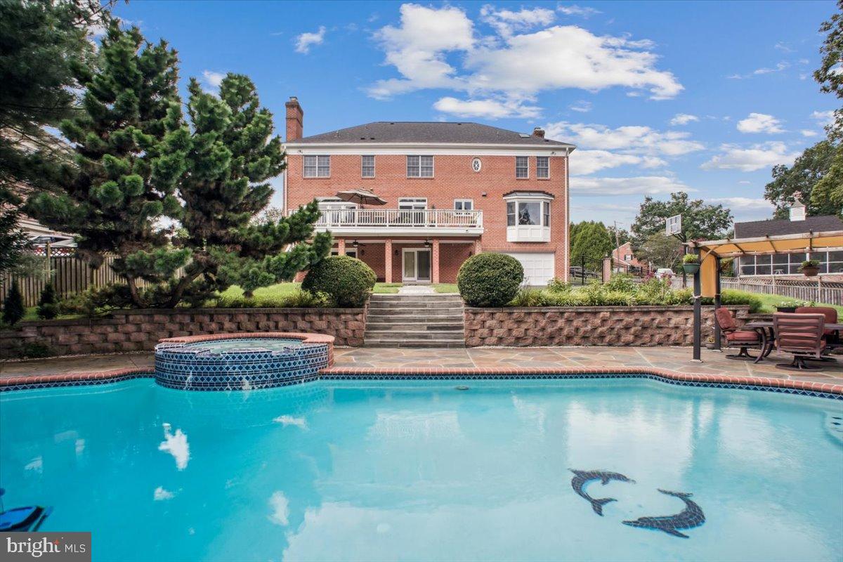 Elegant home with serene poolside oasis.