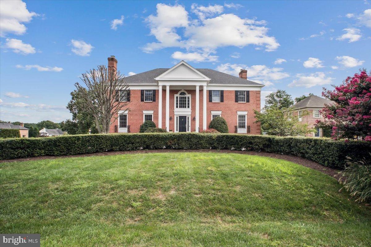 9917 Kendale Road Potomac, MD 20854 - Photo 1 of 39 a front view of a house with garden