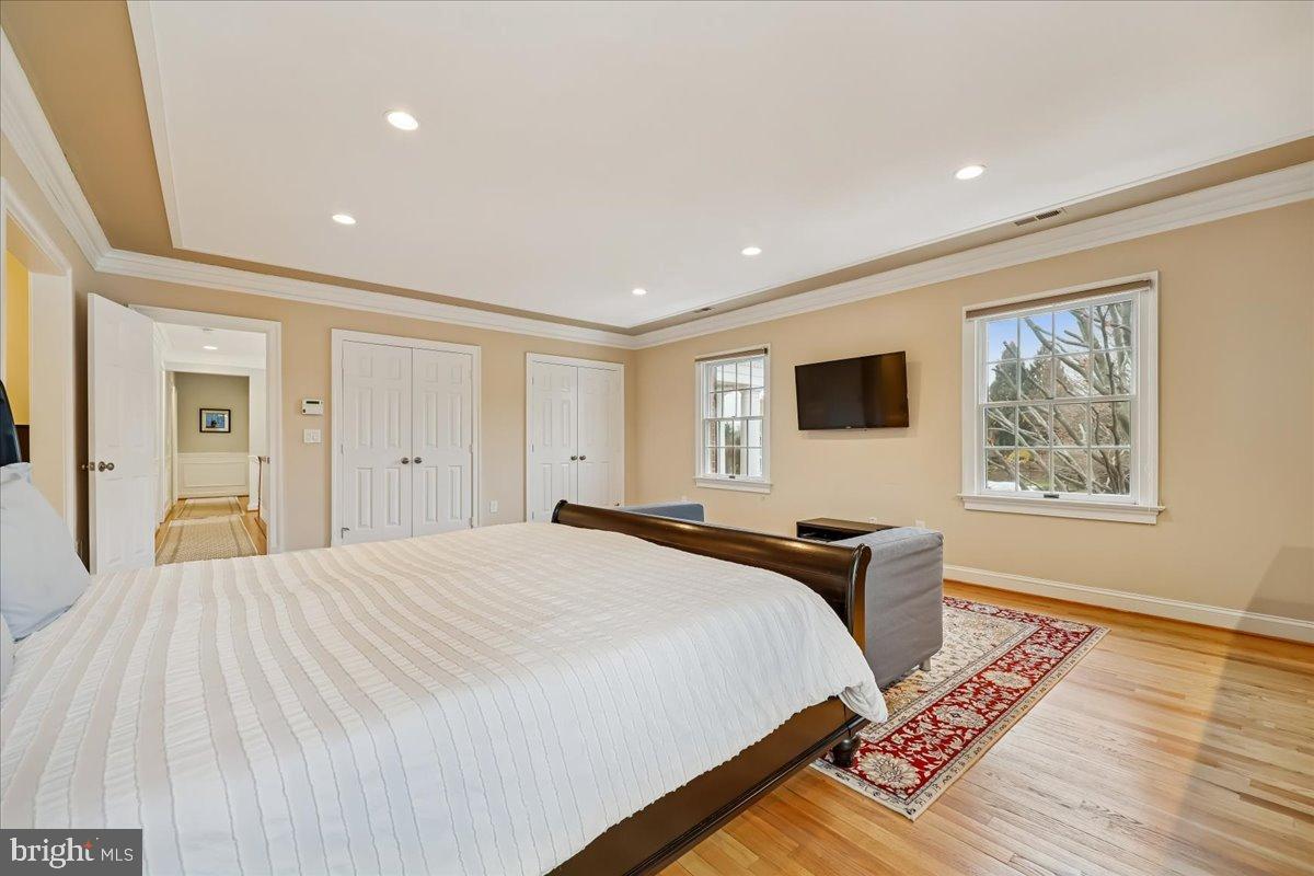 9917 Kendale Road Potomac, MD 20854 - Photo 14 of 39 a bedroom with bed and wooden floor