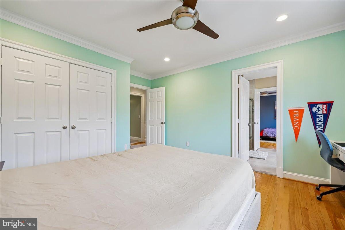 9917 Kendale Road Potomac, MD 20854 - Photo 16 of 39 a bedroom with a bed and a large mirror