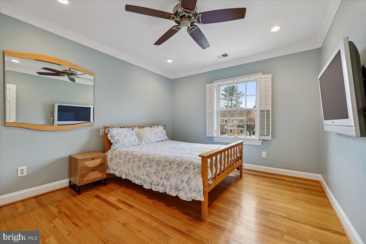 9917 Kendale Road Potomac, MD 20854 - Photo 21 of 39 a room with a bed and wooden floor
