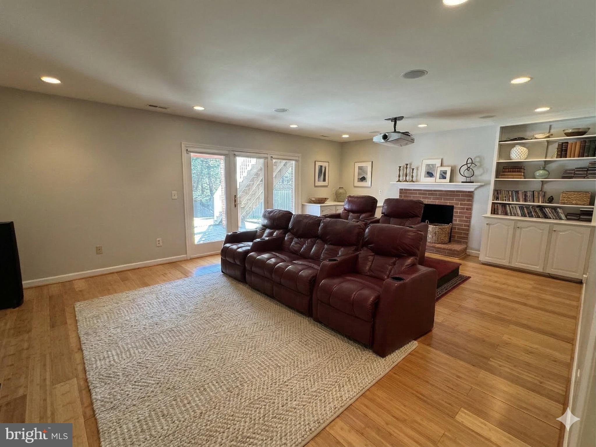 9917 Kendale Road Potomac, MD 20854 - Photo 24 of 39 a living room with furniture and a flat screen tv