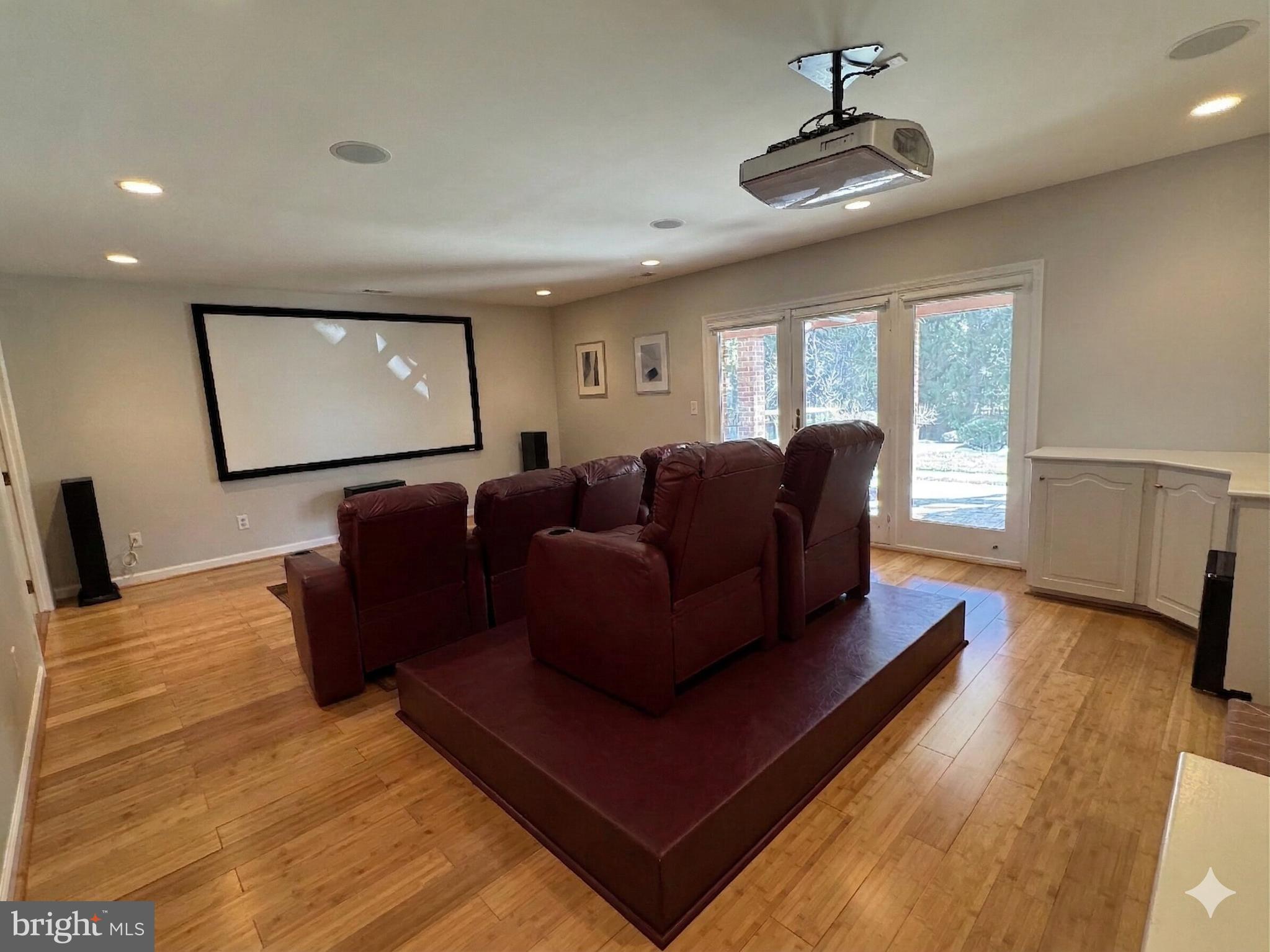 9917 Kendale Road Potomac, MD 20854 - Photo 25 of 39 a living room with furniture and a flat screen tv