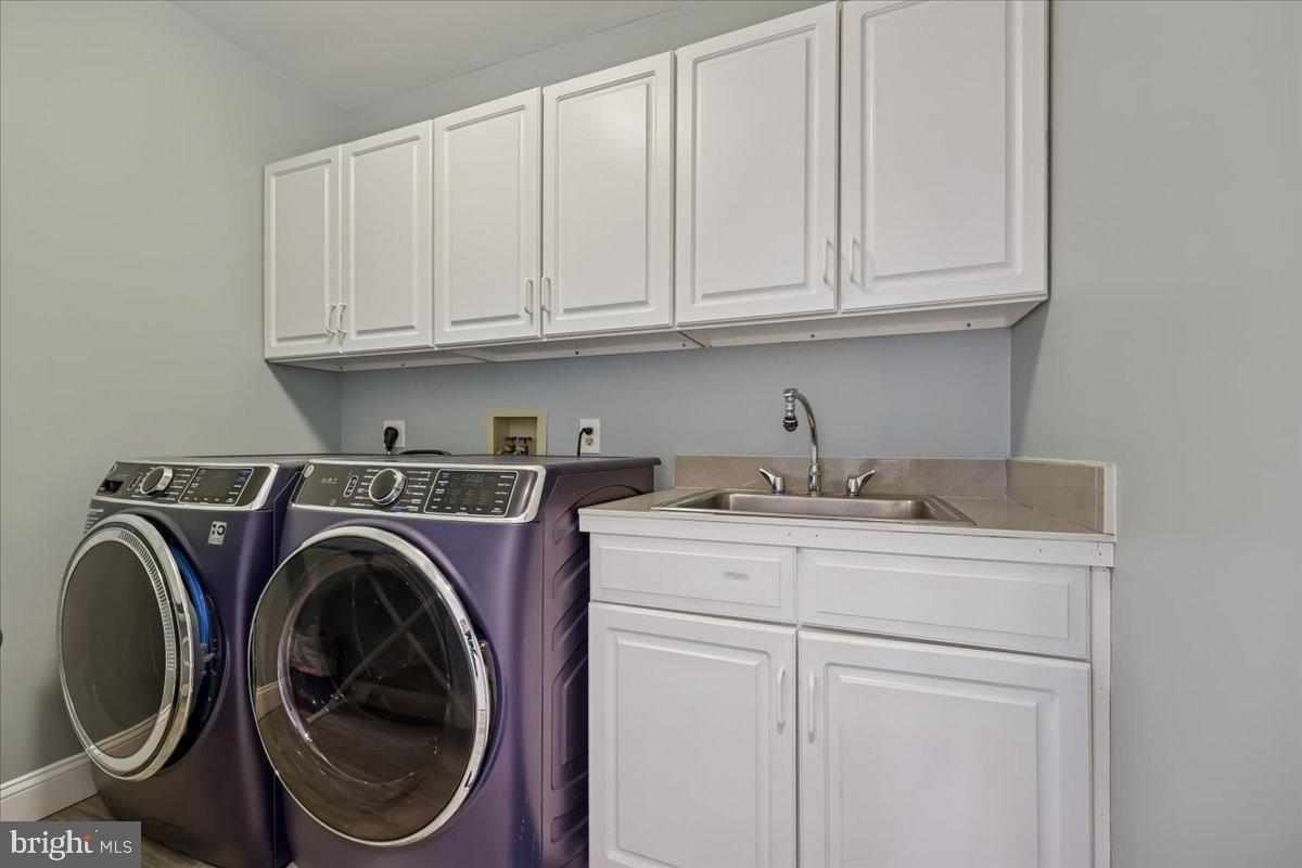 9917 Kendale Road Potomac, MD 20854 - Photo 27 of 39 a utility room with sink dryer and washer