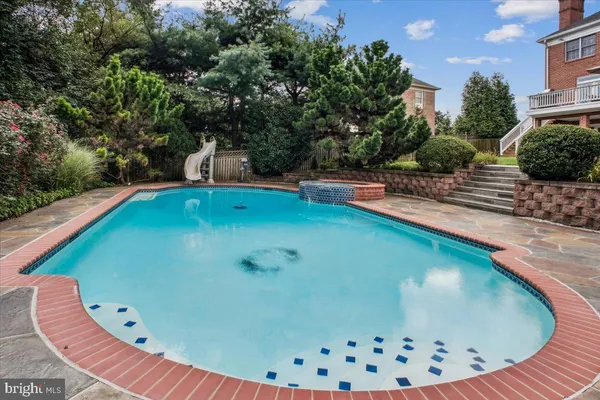 a view of swimming pool with a sitting space