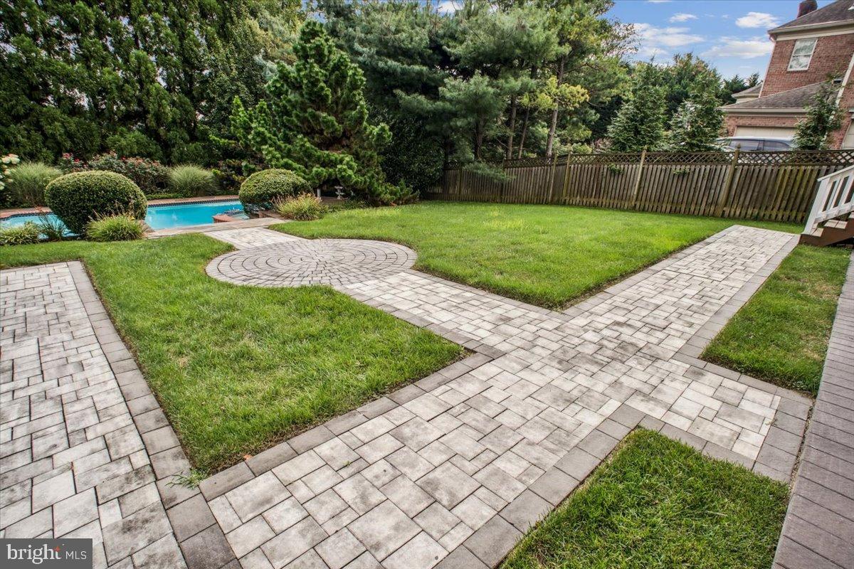 9917 Kendale Road Potomac, MD 20854 - Photo 34 of 39 a view of a garden with a slide