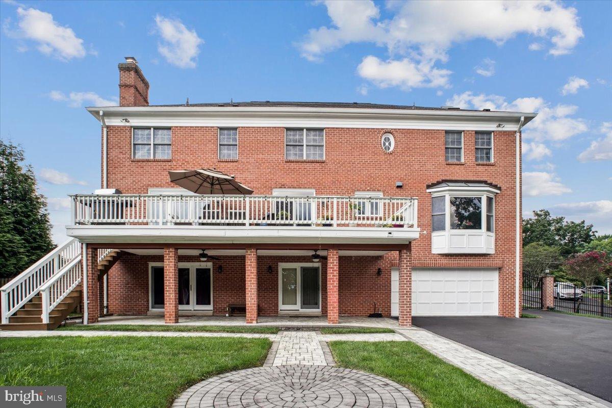 9917 Kendale Road Potomac, MD 20854 - Photo 4 of 39 a front view of a house with a yard