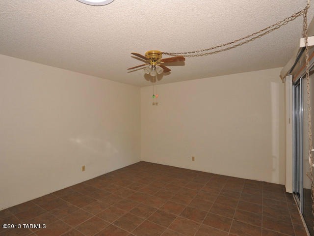 600 East River Road, Unit P Tucson, AZ 85704 - Photo 22 of 28 a view of a room with a fan and a ceiling fan