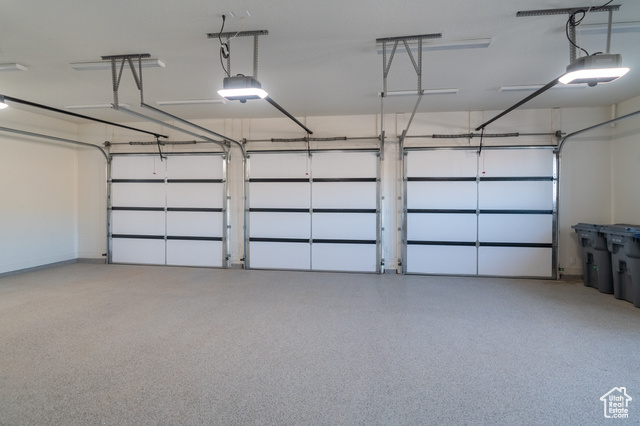 5366 Cyan Lane St. George, UT 84790 - Photo 36 of 39 Garage featuring a garage door opener