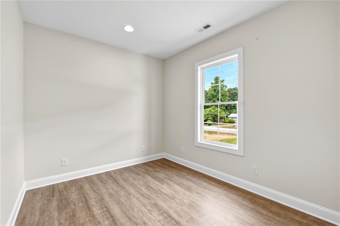 1735 Maw Bridge Road Central, SC 29630 - Photo 23 of 38 This bright room features a large window, offering abundant natural light and an inviting atmosphere.