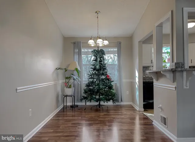 a kitchen with stainless steel appliances granite countertop a refrigerator sink and stove